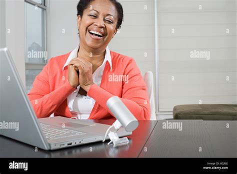 Mature Woman Using Webcam Stock Photo Alamy