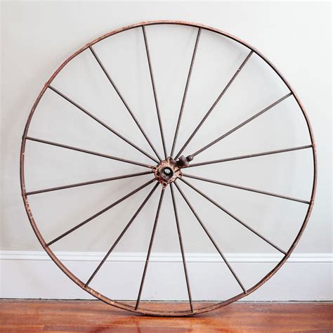rusty metal wagon wheel  borrowed branch