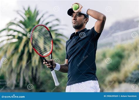 Professional Tennis Player Wearing Sports Clothes Holding Racket Stock