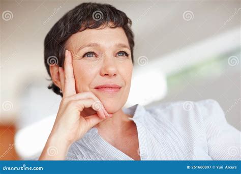 Contemplative Woman Closeup Of Contemplative Mature Woman Looking Away In Deep Thought Stock