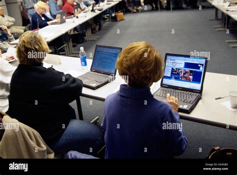 Adult Computer Class Training Is Conducted During A Business Meeting