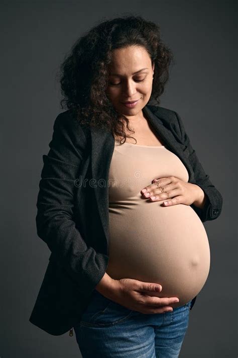 Latin American Curly Confident Pregnant Mother Touching Her Pregnant