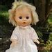 Vintage Hard Plastic Vinyl Blonde Girl Doll Blue Sleep Eyes White Eyelet Dress Movable Joints