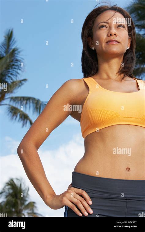Low Angle View Of A Mature Woman Standing With Her Hand On Her Hip Stock Photo Alamy