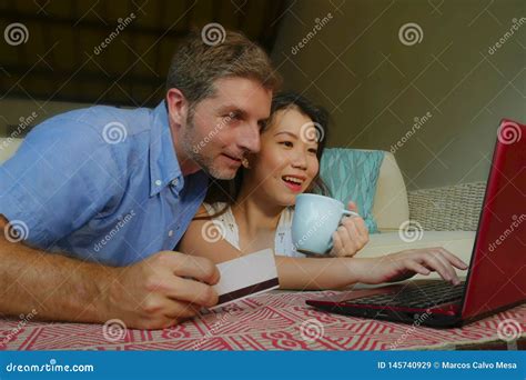 Young Happy And Beautiful Mixed Ethnicity Couple With Caucasian Husband