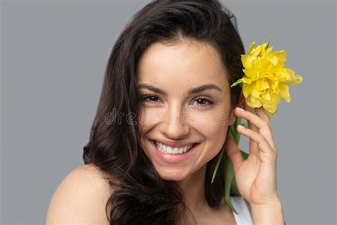 Pretty Brunette Girl With A Flower In Her Hair Looking Happy Stock Photo Image Of Cute Beauty