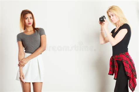 Blonde Girl Photographing Mulatto Woman Stock Image Image Of Human Fashion