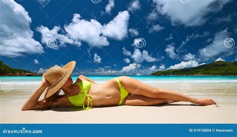 Woman In Yellow Bikini Lying On Beach At Seychelles Stock Photo Image