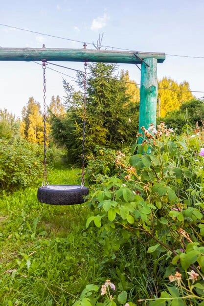 Premium Photo Handmade Swing In Countryside Outdoors