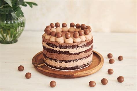 Delicious Chocolate Naked Cake With Choco Balls And Cream On A White Table Stock Photo Image