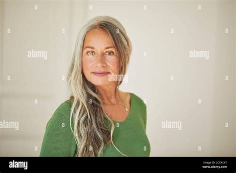 Confident Mature Woman Standing At Home Stock Photo Alamy