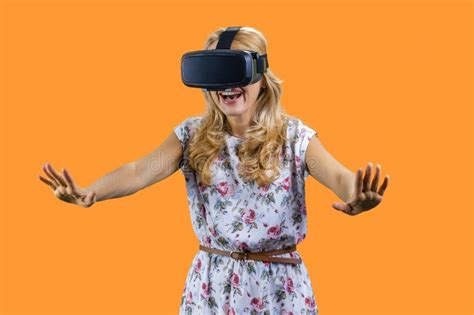 Happy Shocked Mature Woman In Virtual Reality Headset Stretching Her Arms Stock Photo Image