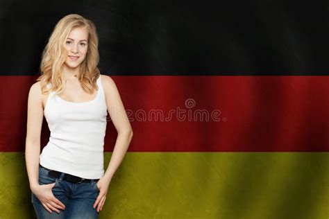 Travel In Germany Concept Pretty Blonde Woman Against The Germany Flag Background Stock Photo