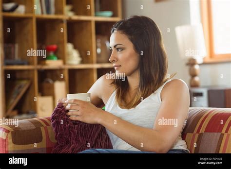 Beautiful Brunette Relaxing On The Couch Stock Photo Alamy