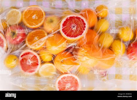 Fresh Citrus Fruits On Table Covered With Plastic Sheet Stock Photo Alamy