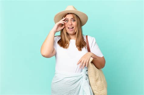 Premium Photo Curvy Pretty Blonde Woman Looking Happy Astonished And Surprised