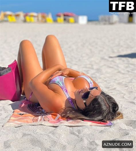 Claudia Romani Sexy Poses Showcasing Her Hot Tits And Ass Wearing A Lilac Bikini At Miami Beach