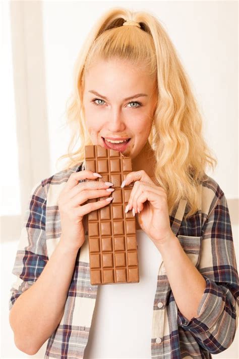 Beautiful Blonde Woman Eats A Big Chocolate Stock Photo Image Of Healthy Makeup