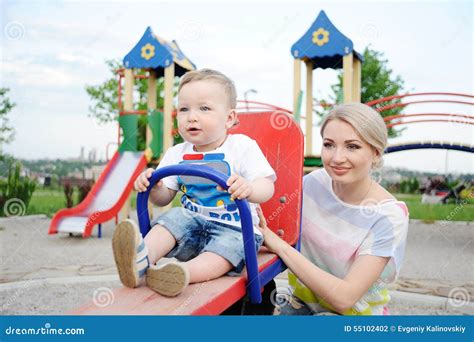 Mom and Baby Son Play in the Playground Stock Photo - Image of family