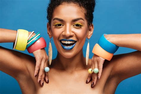 Free Photo Magnificent Half Naked Woman With Colorful Makeup Smiling And Demonstrating