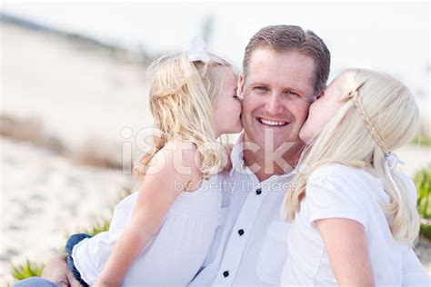 Handsome Dad Getting Kisses From His Cute Daughters Stock Photo ...