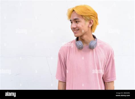Thai Gay Teen Man With Pink Shirt And Septum Ring Against White Background Stock Photo Alamy