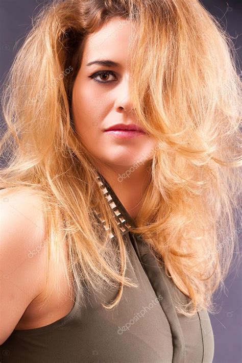 Portrait Of A Blonde Busty Woman Stock Photo By STphotography