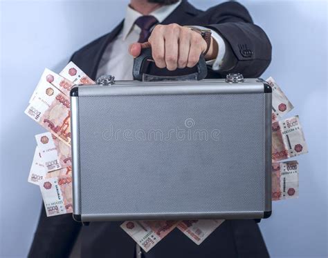 Man In Suit Holds Metal Briefcase Full Of Money Stock Image Image Of