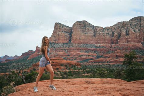 Little girl on the edge of a cliff at Cathedral Rock in Sedona, Arizona