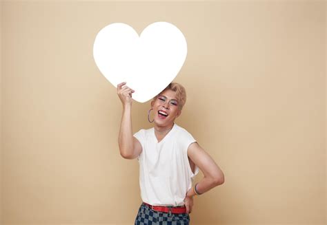 Free Photo Youth Asian Transgender Lgbt Showing Rainbow Heart Isolated Over Nude Color Background