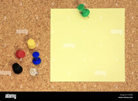 Post It And Colorful Thumbtacks On Cork Board Stock Photo Alamy