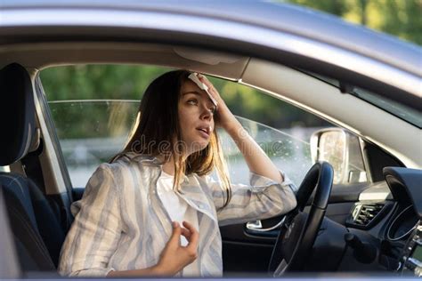 Woman Driver Being Hot During Heat Wave In Car Suffering From Hot Weather Wipes Sweat From