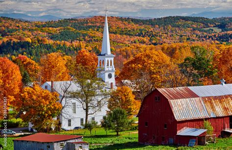 Congregational Church and farm with red barn at sunny autumn day in