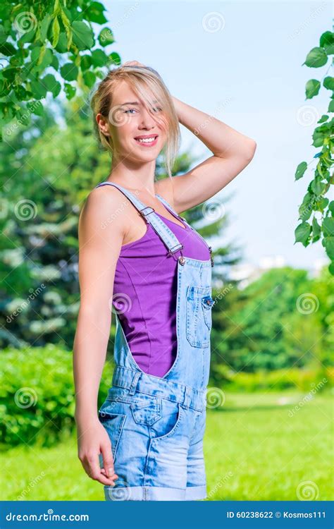 Portrait Of A Beautiful Blonde Woman In A Park Stock Photo Image Of