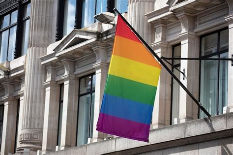 Premium Photo An Lgbt Gay Pride Rainbow Flag Hangs From A Building