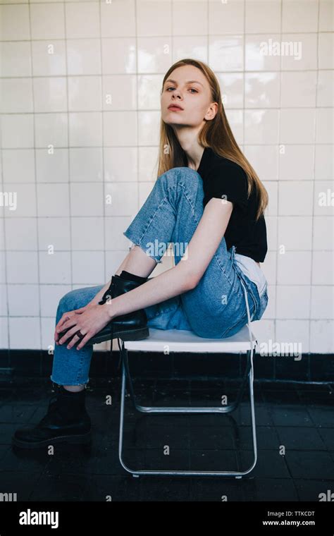 Woman Sitting On Chair Legs Hi Res Stock Photography And Images Alamy