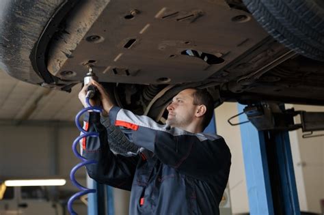 Premium Photo | Hand of car mechanic with wrench. auto repair garage.