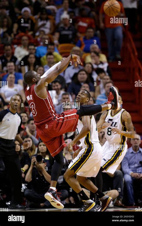 Miami Heat S Dwyane Wade 3 Shoots Over Utah Jazz S Alec Burks Center