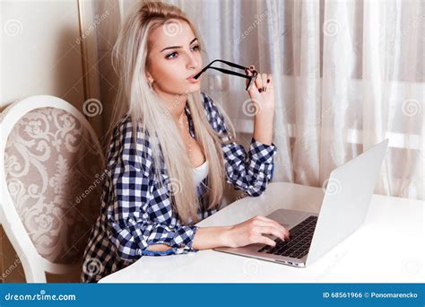 Beautiful Blonde Girl With Blue Eyes With Laptop On Desk Looking Stock Photo Image Of