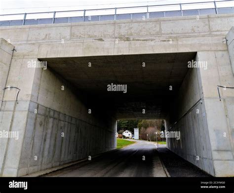 Road Leading Through A Modern Concrete Rail Underpass Stock Photo Alamy