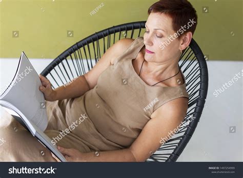 Elegant Mature Woman Sitting On Chair Stock Photo 1497254999 Shutterstock