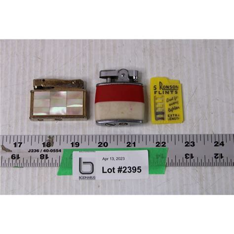 2 Vintage Lighters And Flint Bodnarus Auctioneering