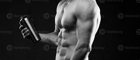 Photo Of Half Naked Sportsman Holding Bottle Of Water Cropped Photo Studio Indoor Close Up