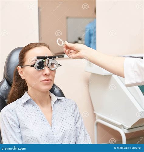 Ophthalmologist Doctor In Exam Optician Laboratory With Female Patient Eye Care Medical