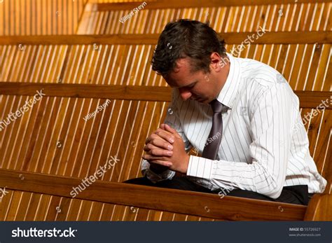 A Man Praying In Church Stock Photo 55726927 Shutterstock