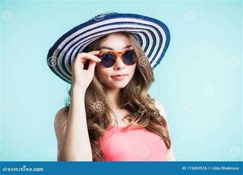 Young Beautiful Woman In Bikini Hat And Sunglasses Standing On The