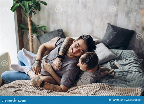 Two Caucasian Gay Guys Hugging And Having Fun In Bed Indoors Stock Photo Image Of Colorful