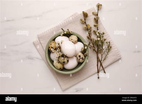 Easter Eggs Flowers And Pussy Willow Branches On White Marble Table Top View Stock Photo Alamy