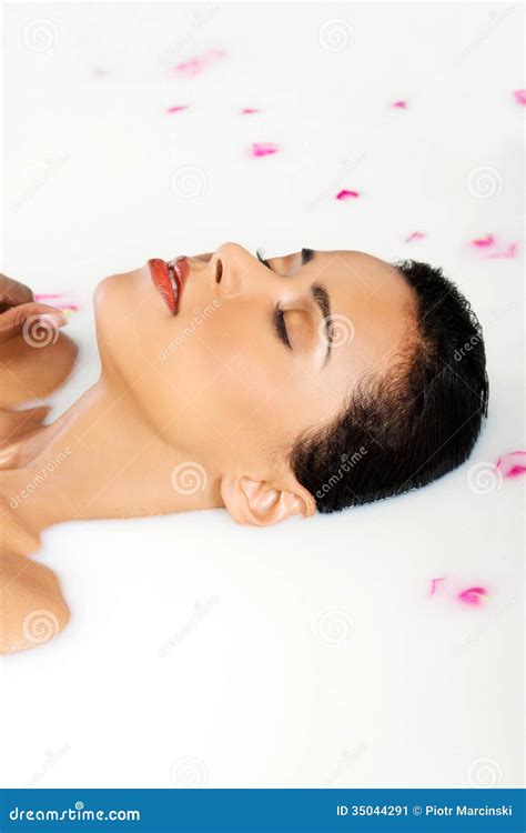 Attractive Naked Woman Lying In A Milk Bath With Rose Petal Stock Image Image Of Human Girl