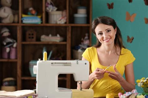 Premium Photo | Beautiful young needlewoman in workshop